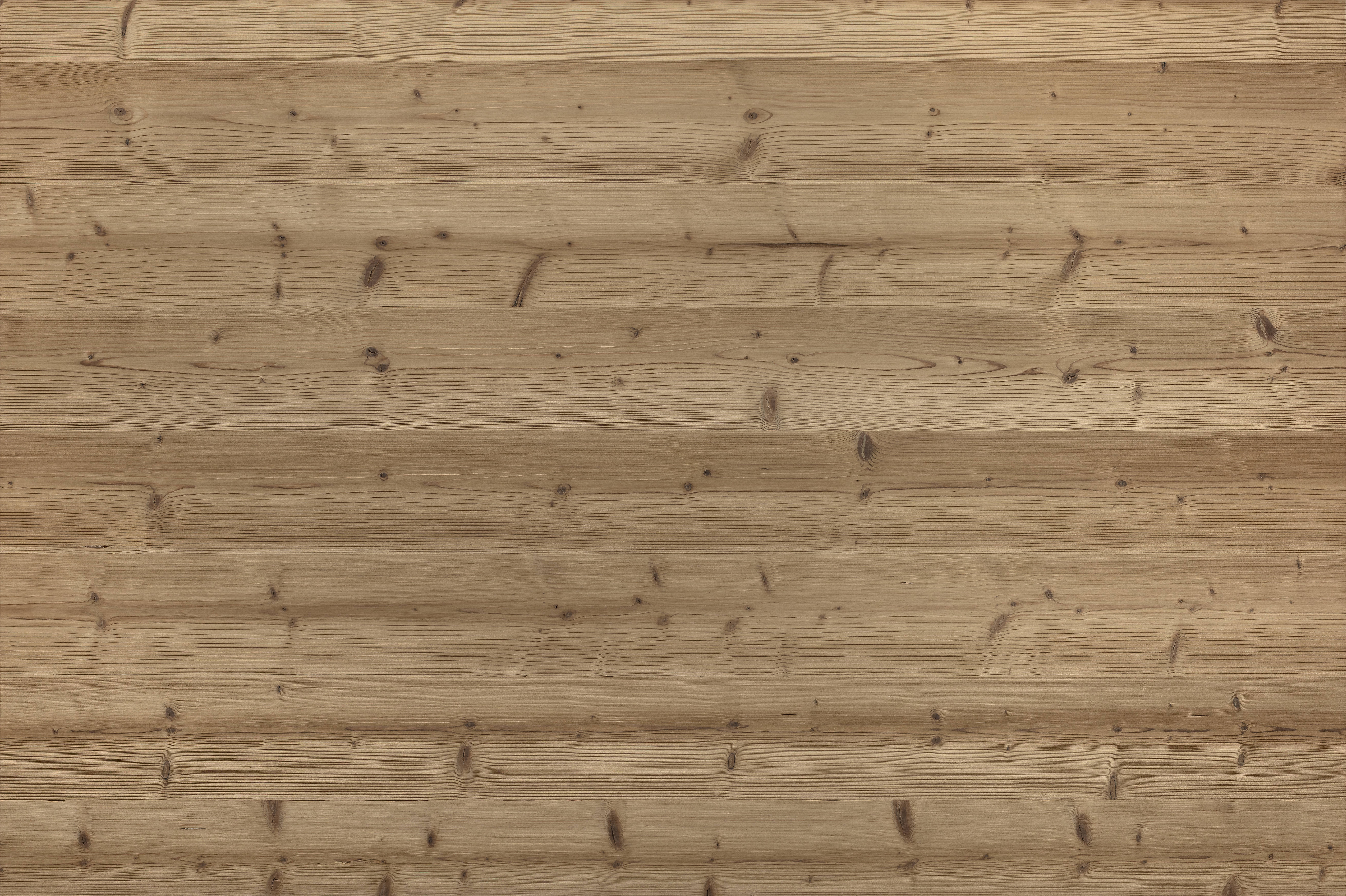 Detailaufnahme einer thermisch behandelten Holzoberfläche aus der Serie „Gran Paradiso 190“, bei 190 °C behandelt und gebürstet. Die warme Farbgebung und betonte Maserung verleihen dem Holz ein charaktervolles und edles Erscheinungsbild.